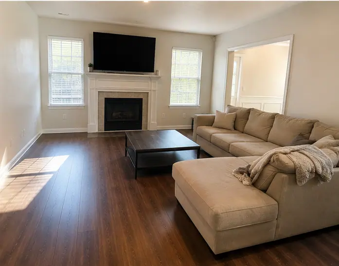 Sunlit Dallas living room with clear surfaces after a one-time cleaning visit